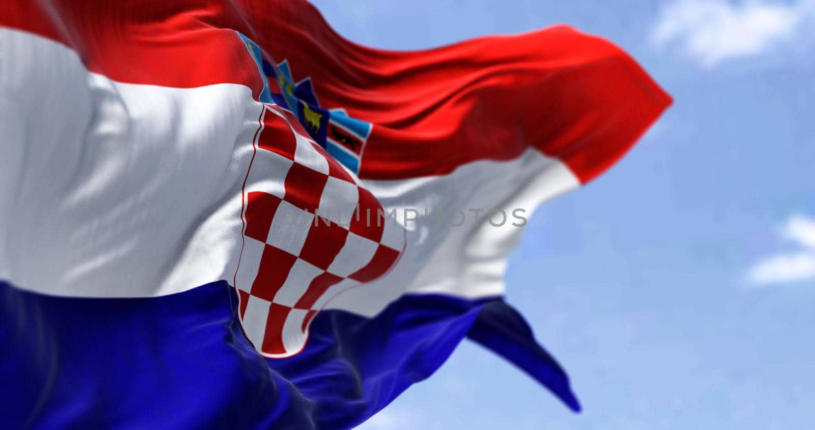 Detail of the national flag of Croatia waving in the wind on a clear day. Democracy and politics. Patriotism. European country. Selective focus.