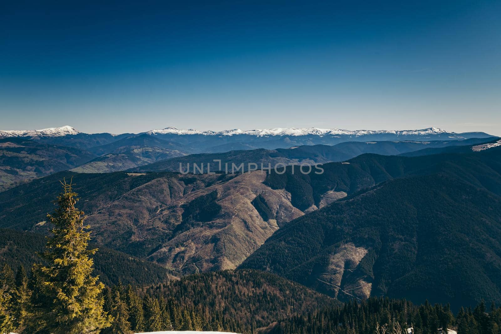 Landscape of snow-capped peaks, late winter early spring. High quality photo