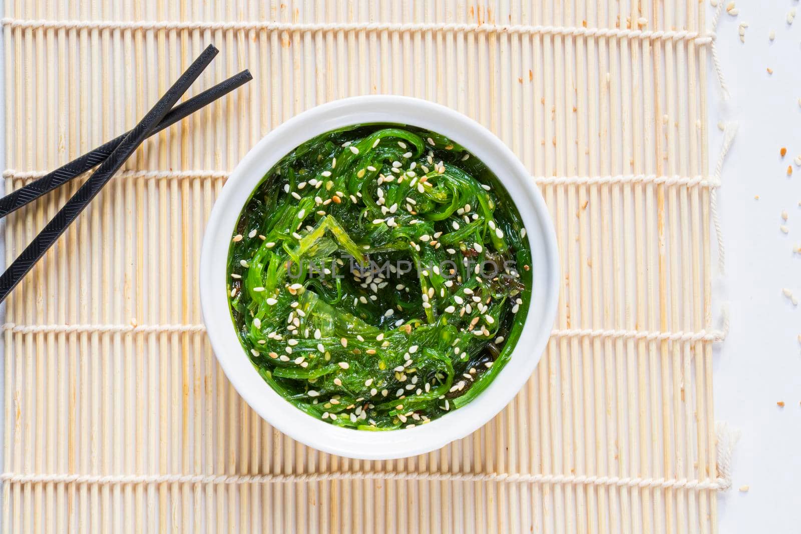 Wakame in the white bowl and chopsticks