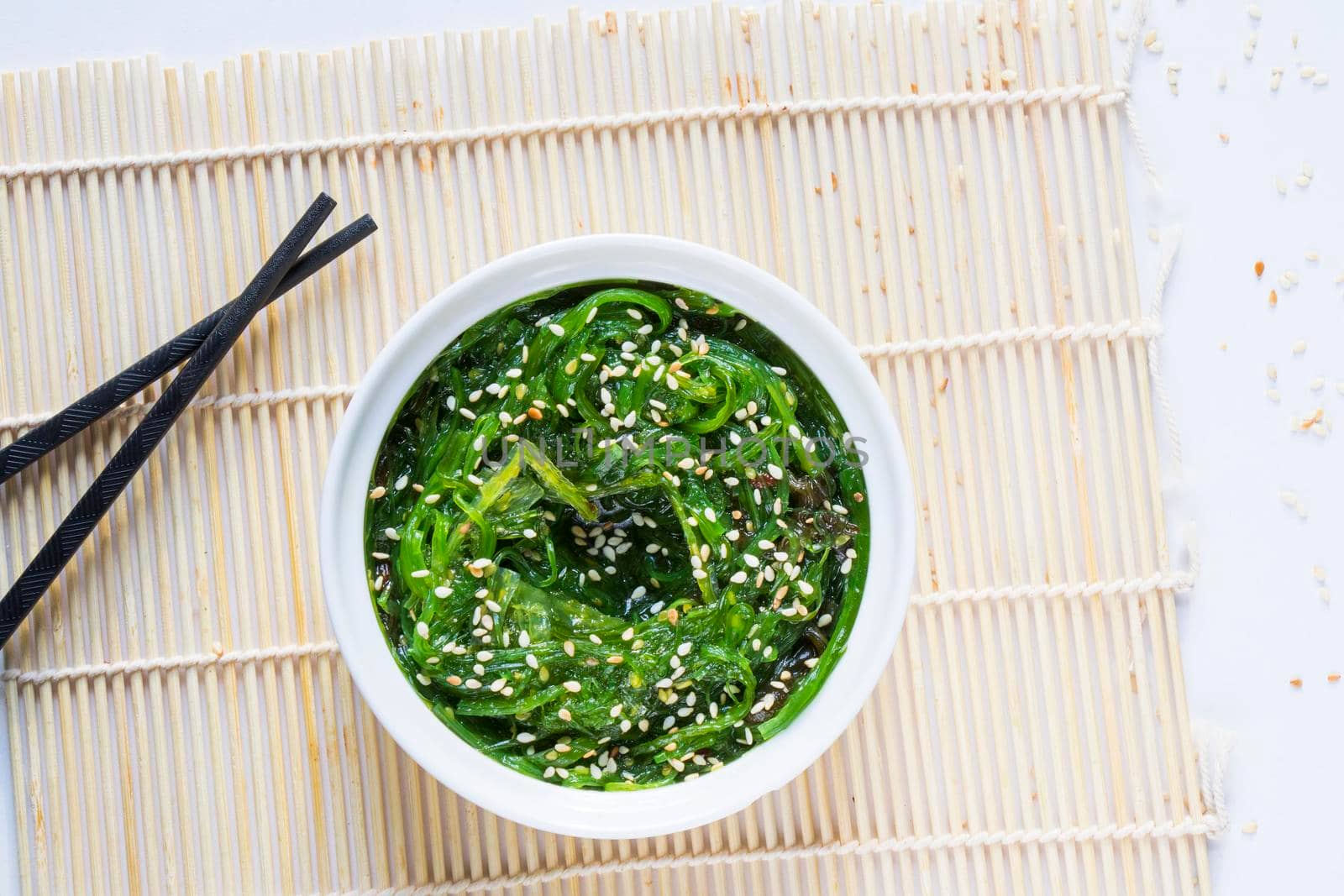 Wakame in the white bowl and chopsticks