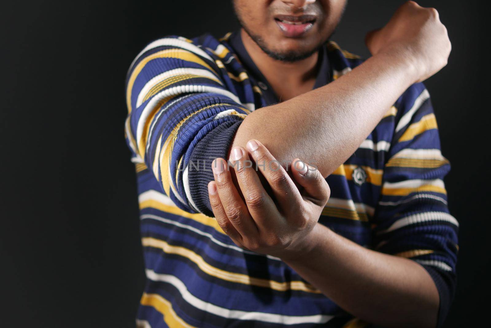 man with elbow pain. Pain relief concept