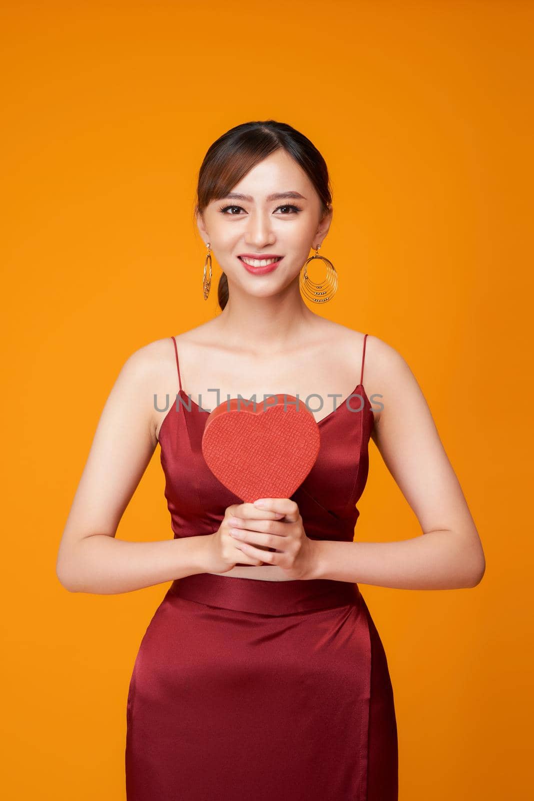 Portrait of Beautiful woman with red heart shaped box by makidotvn