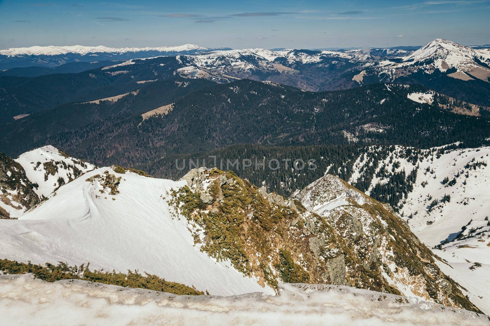 Snow in the mountains and blue sky, spring. High quality photo
