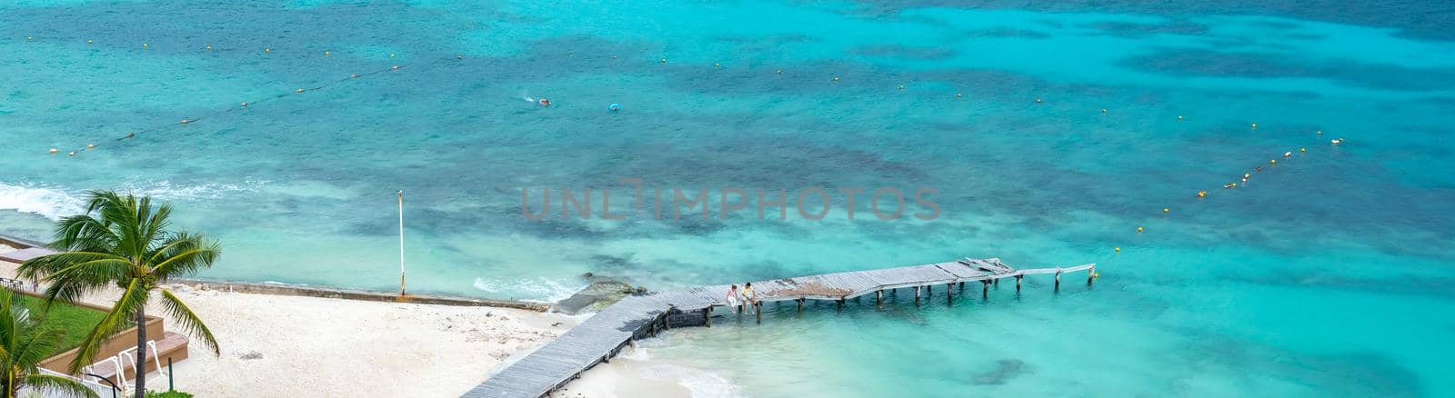 Caribbean wood pier with turquoise aqua sea. Nature panoramic landscape: Amazing Panorama sandy tropical beach