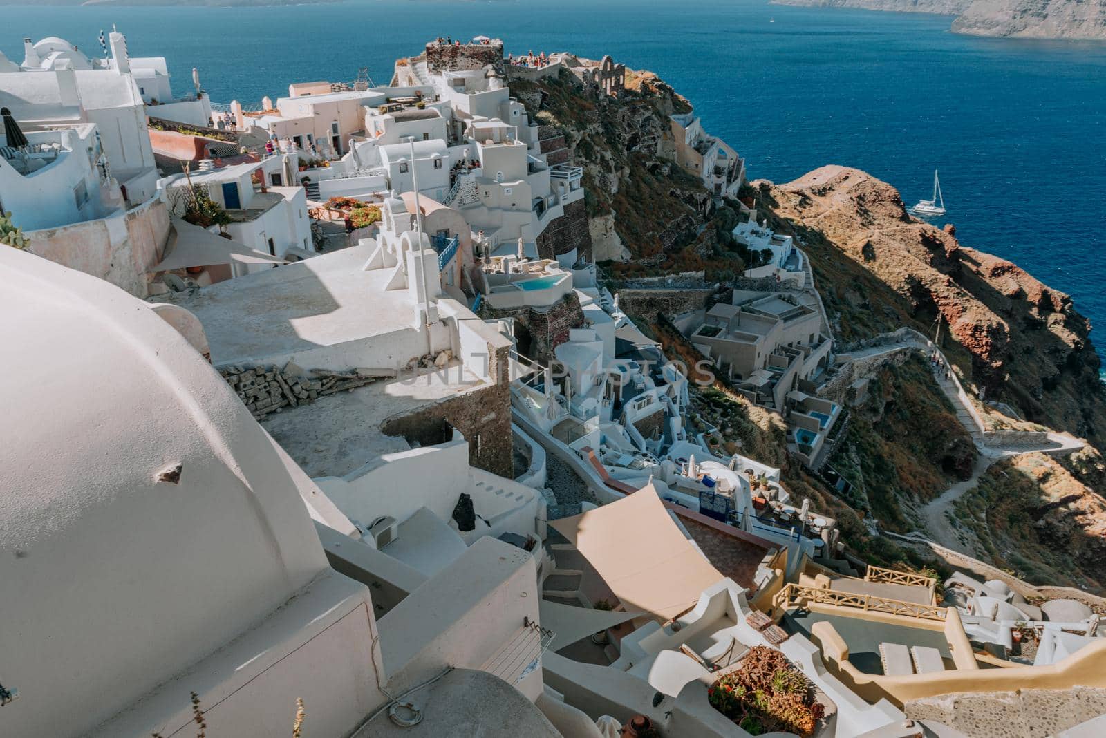 Oia Santorini Greece famous with romantic and beautiful sunsets. Oia village in Santorini island.Greece. by Andrii_Ko