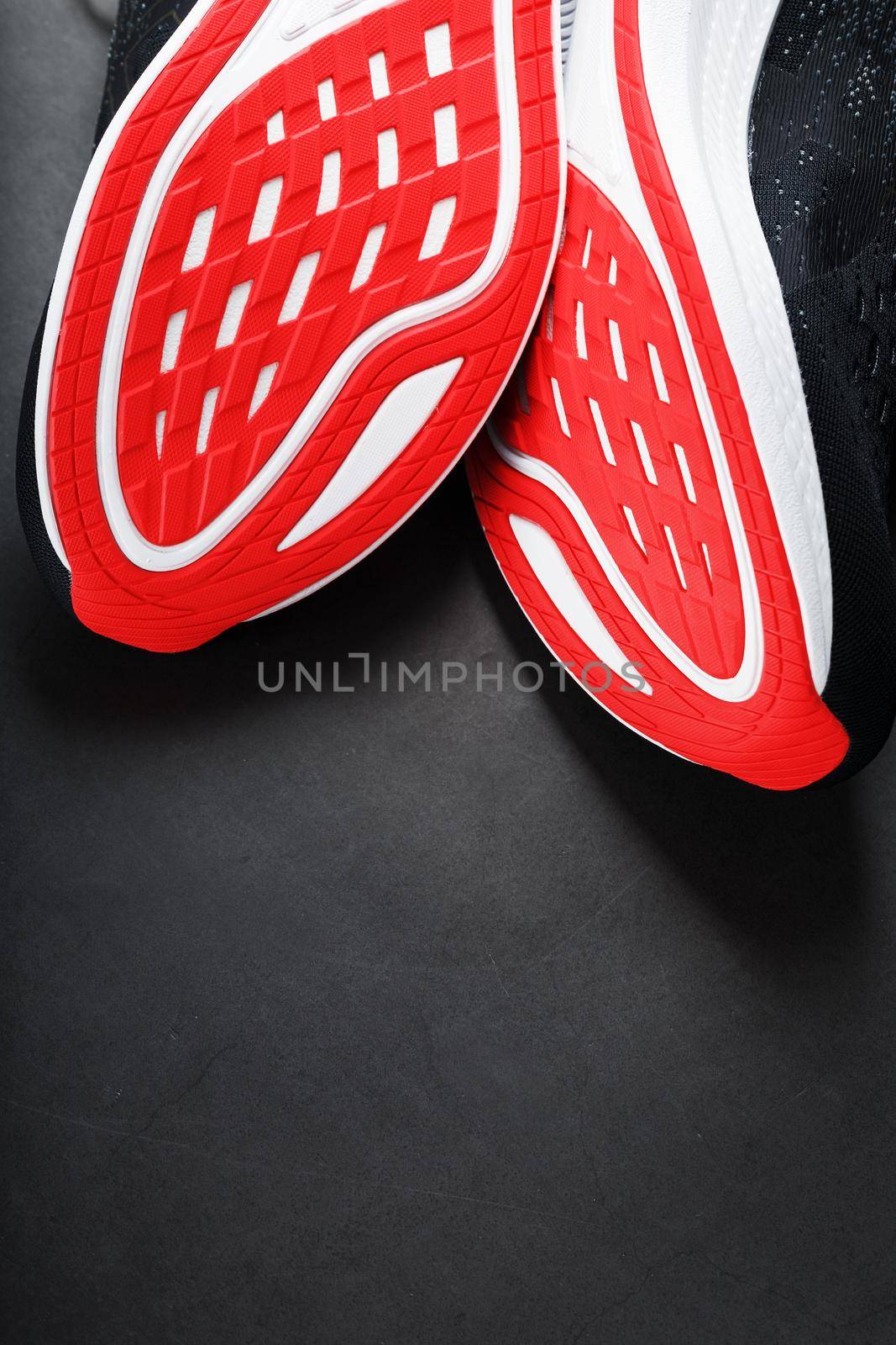 Close-up of the sole of a sport running shoe for running in red Sports technology