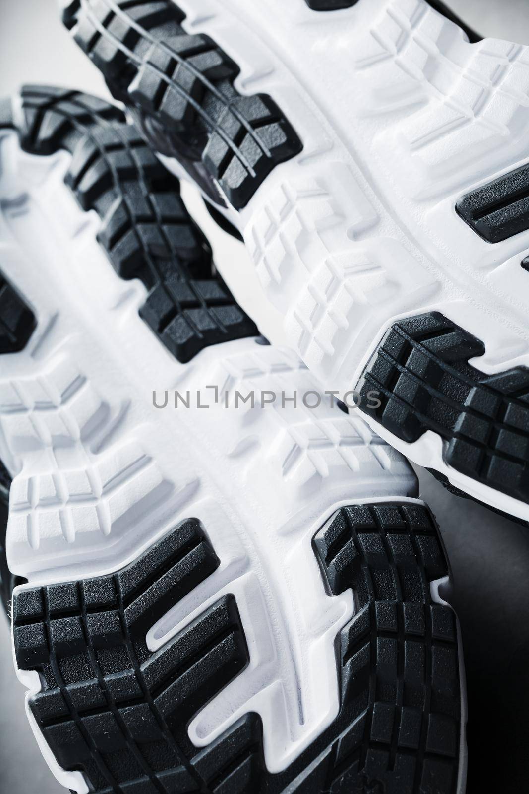 The sole of the sports sneakers for running in black and white close-up. Sports technology