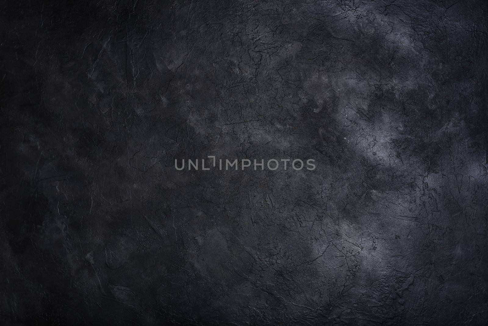 Dark textured concrete wall background. Copy space