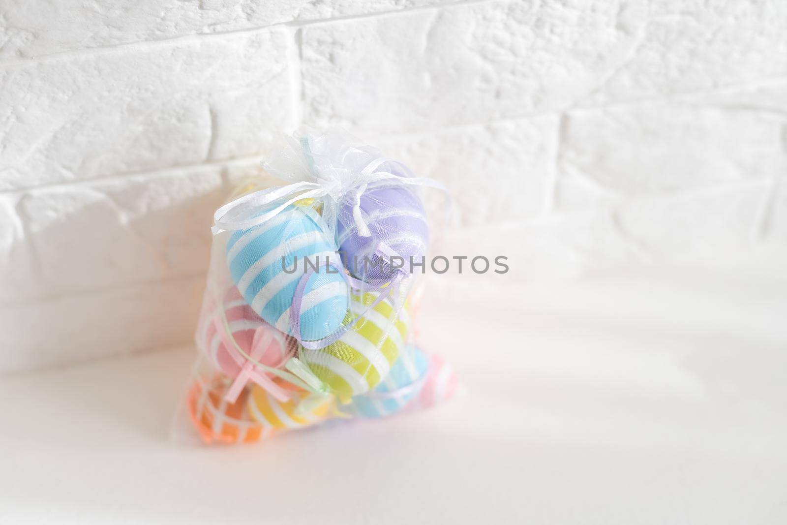 Creatively Easter painted eggs in a bag on a white background. Flat lay, copy space. by Andelov13