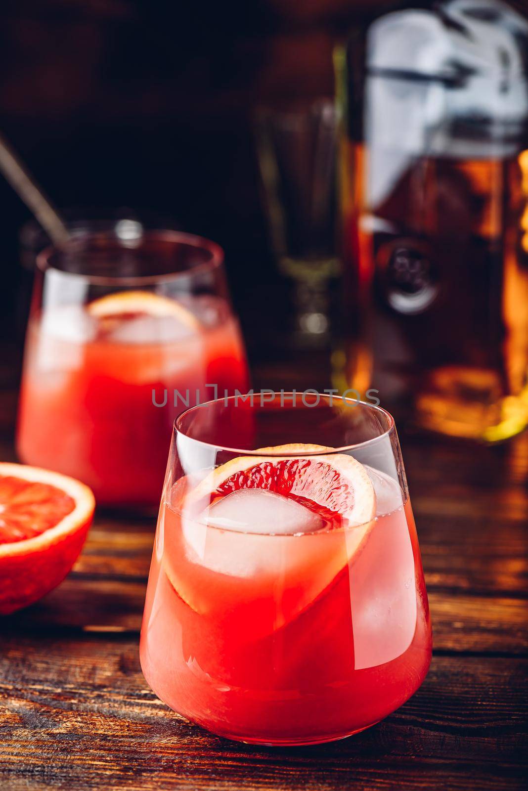 Whiskey sour cocktail with aged bourbon, blood orange juice and cherry syrup