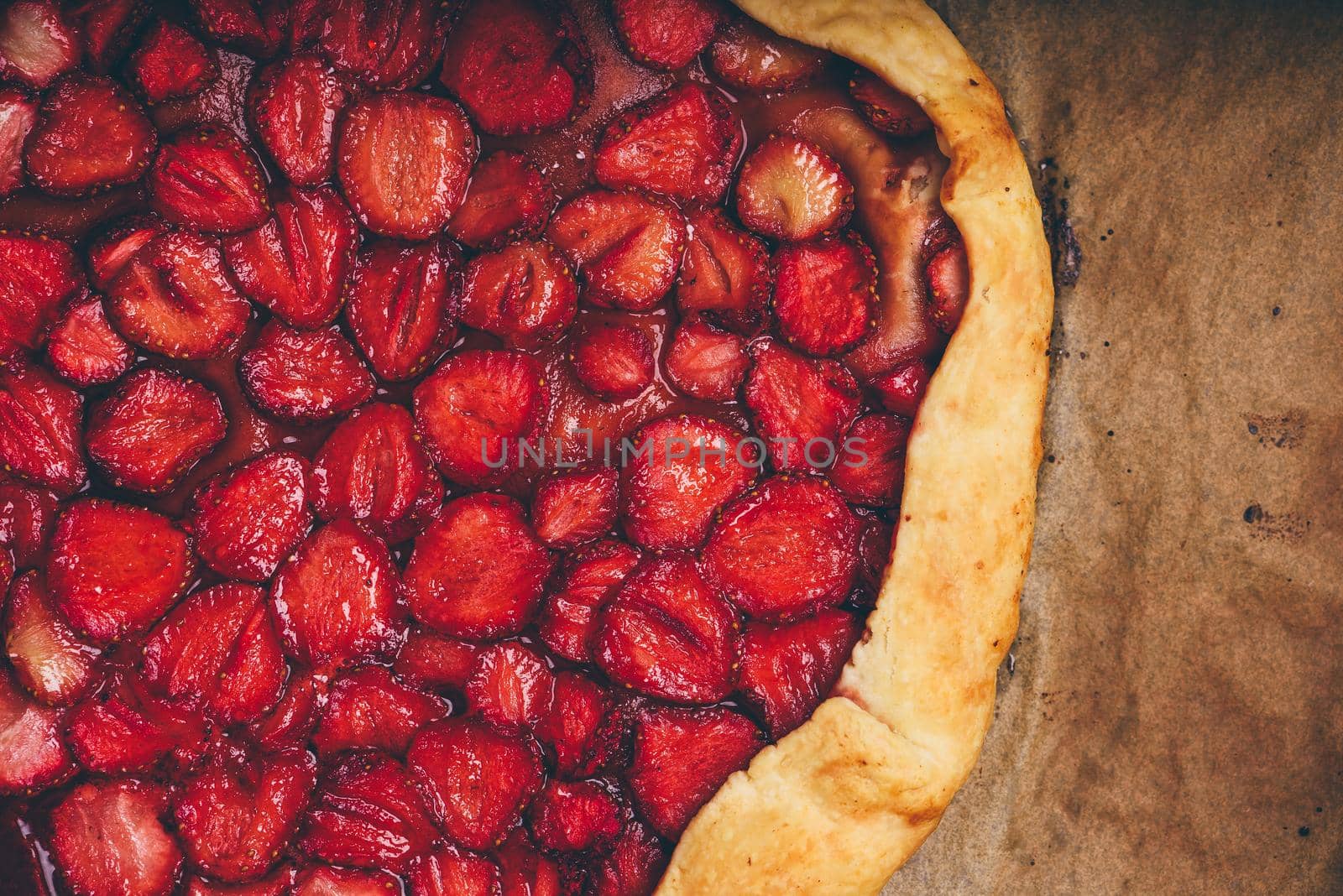 Part Of Baked Strawberry Galette On Baking Paper by Seva_blsv