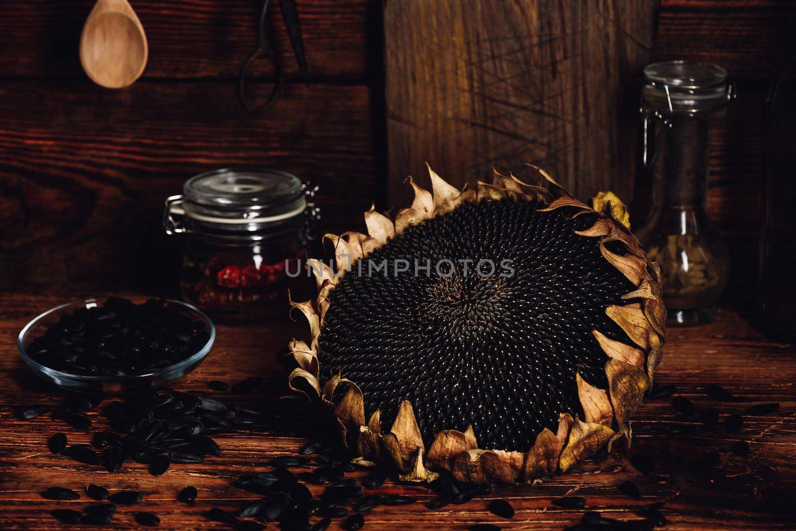 Dried sunflower and roasted seeds on the old wooden table