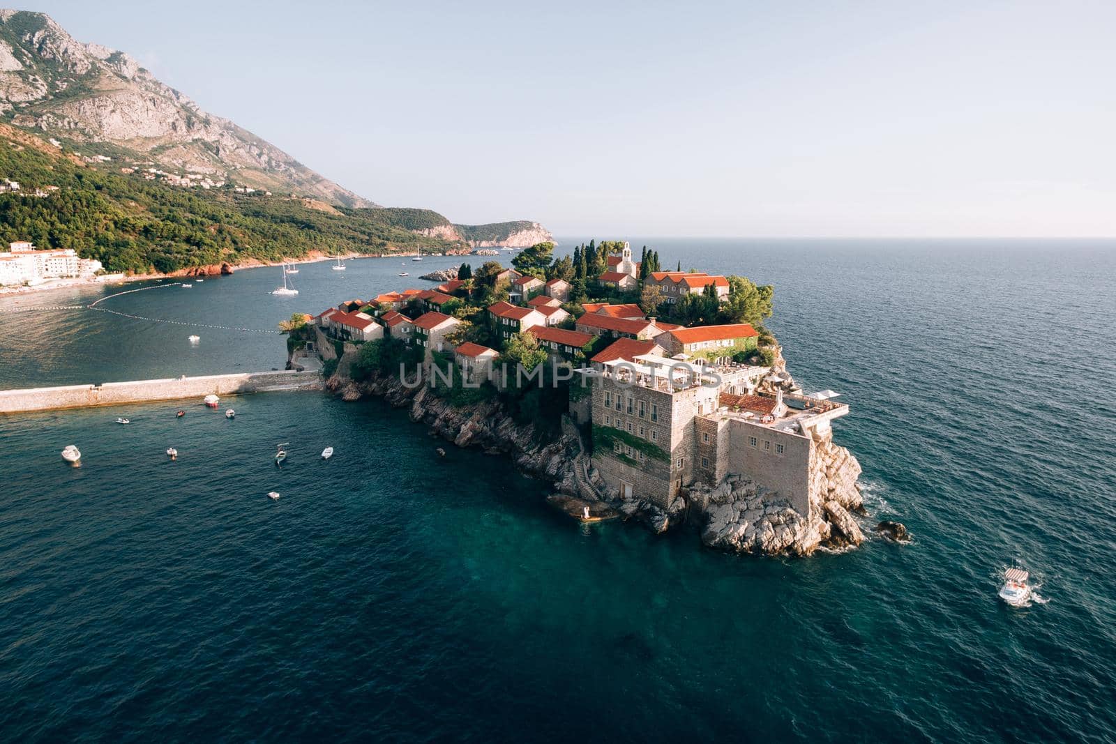 Ancient stone buildings of the island of Sveti Stefan. Aerial view. High quality photo