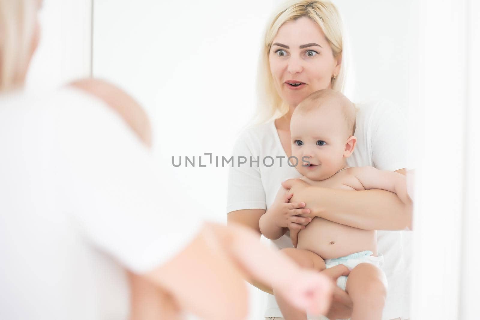 happy mother holding her baby.