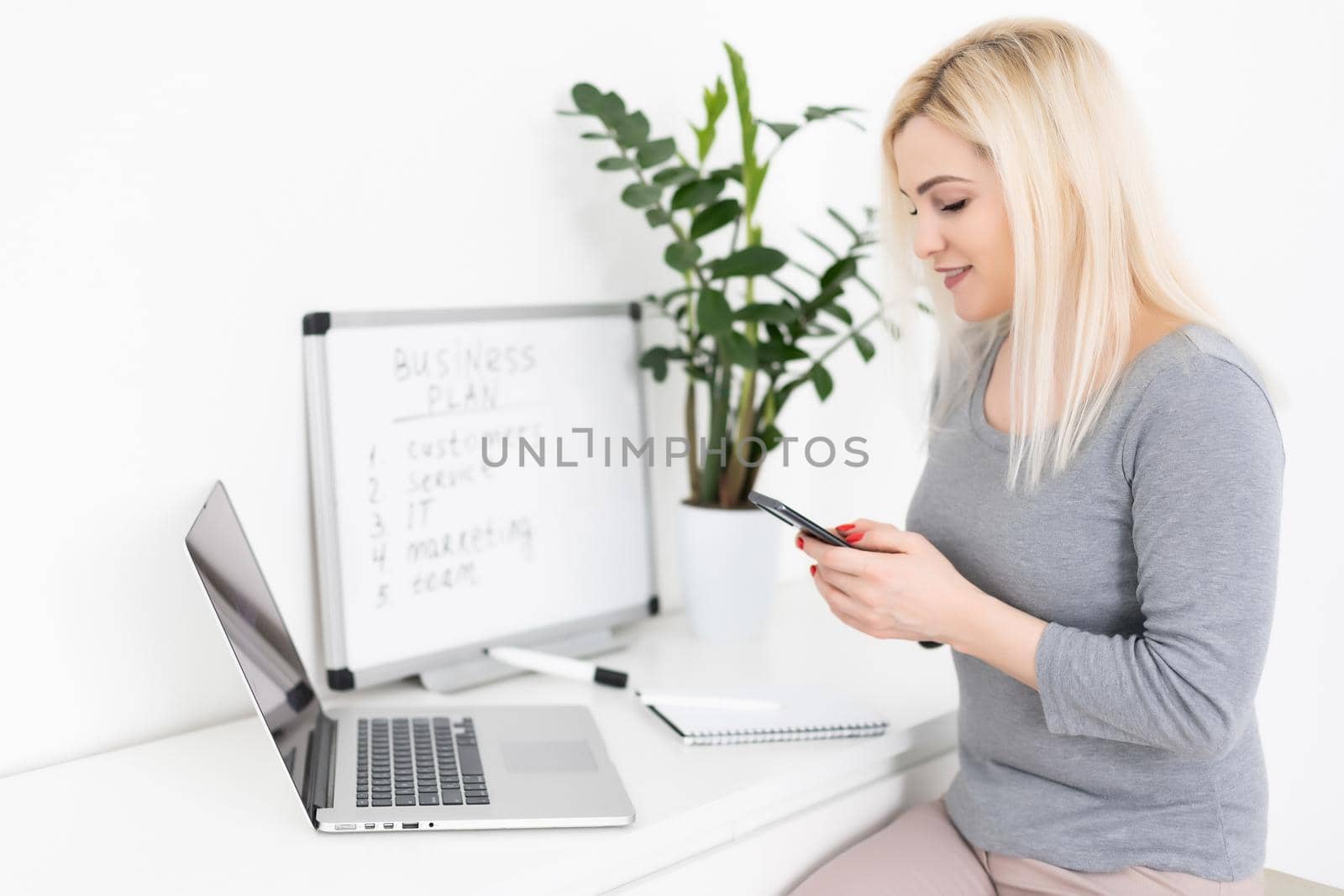 Everything must be planned. Attractive young woman writing something down on the blackboard. woman writing business plan.