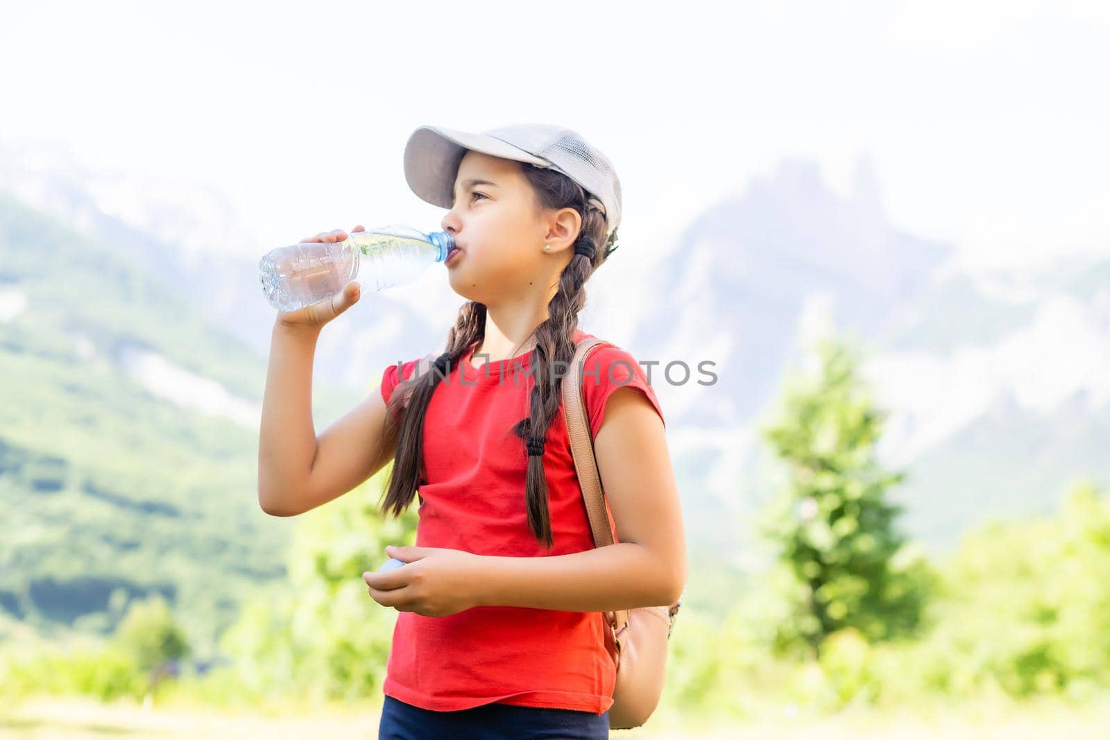 Portrait of a cute little girl in mountains