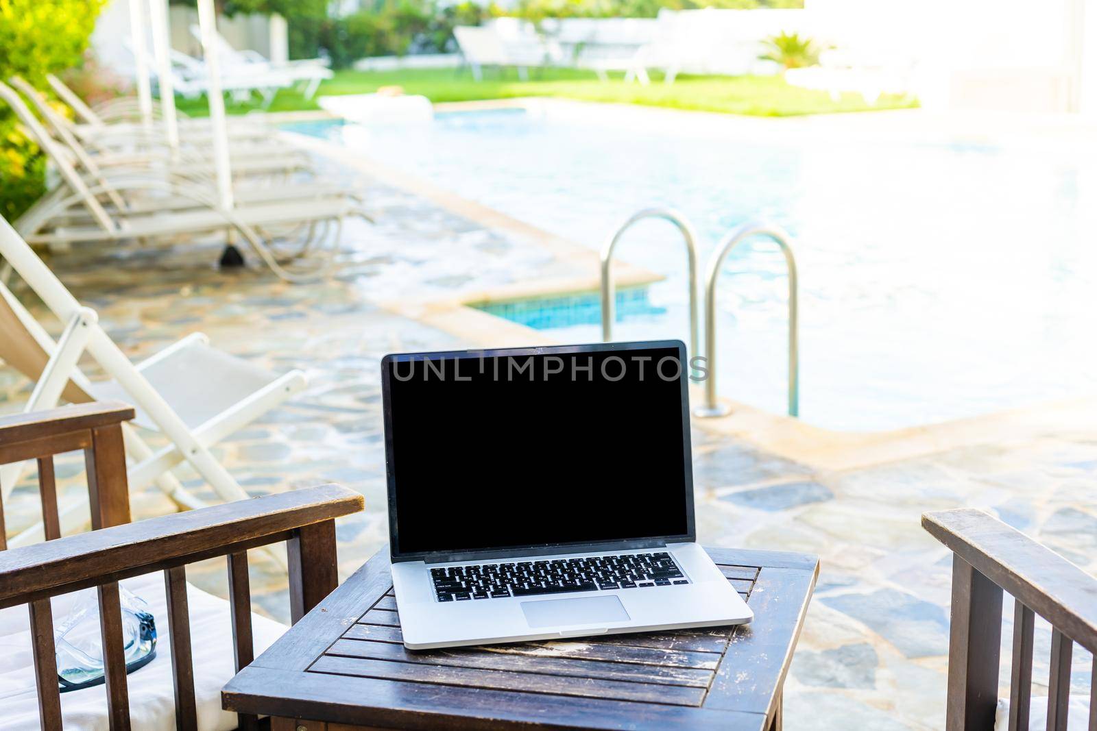 computer on table background as a pool. by Andelov13