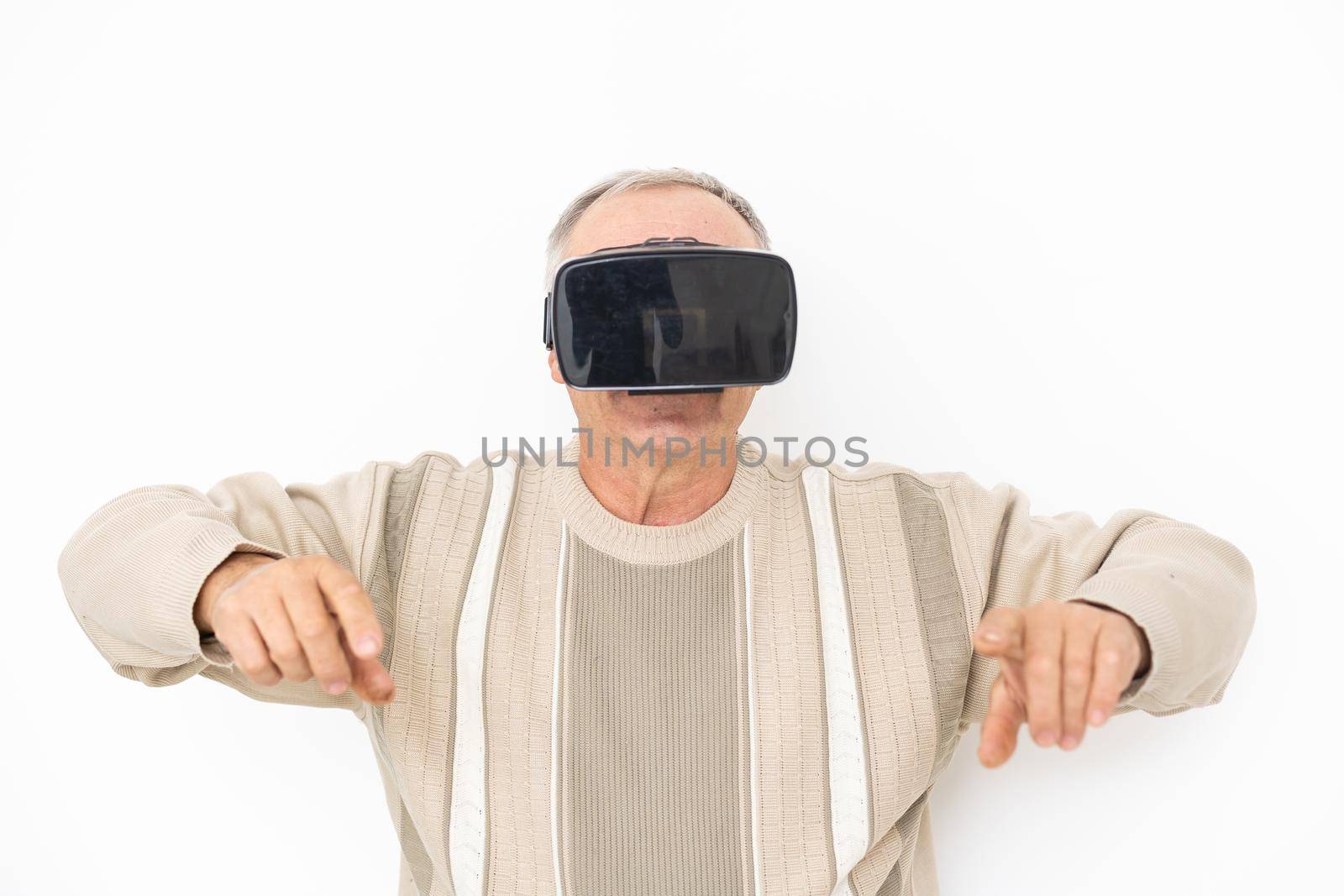 Senior man using VR Goggles.