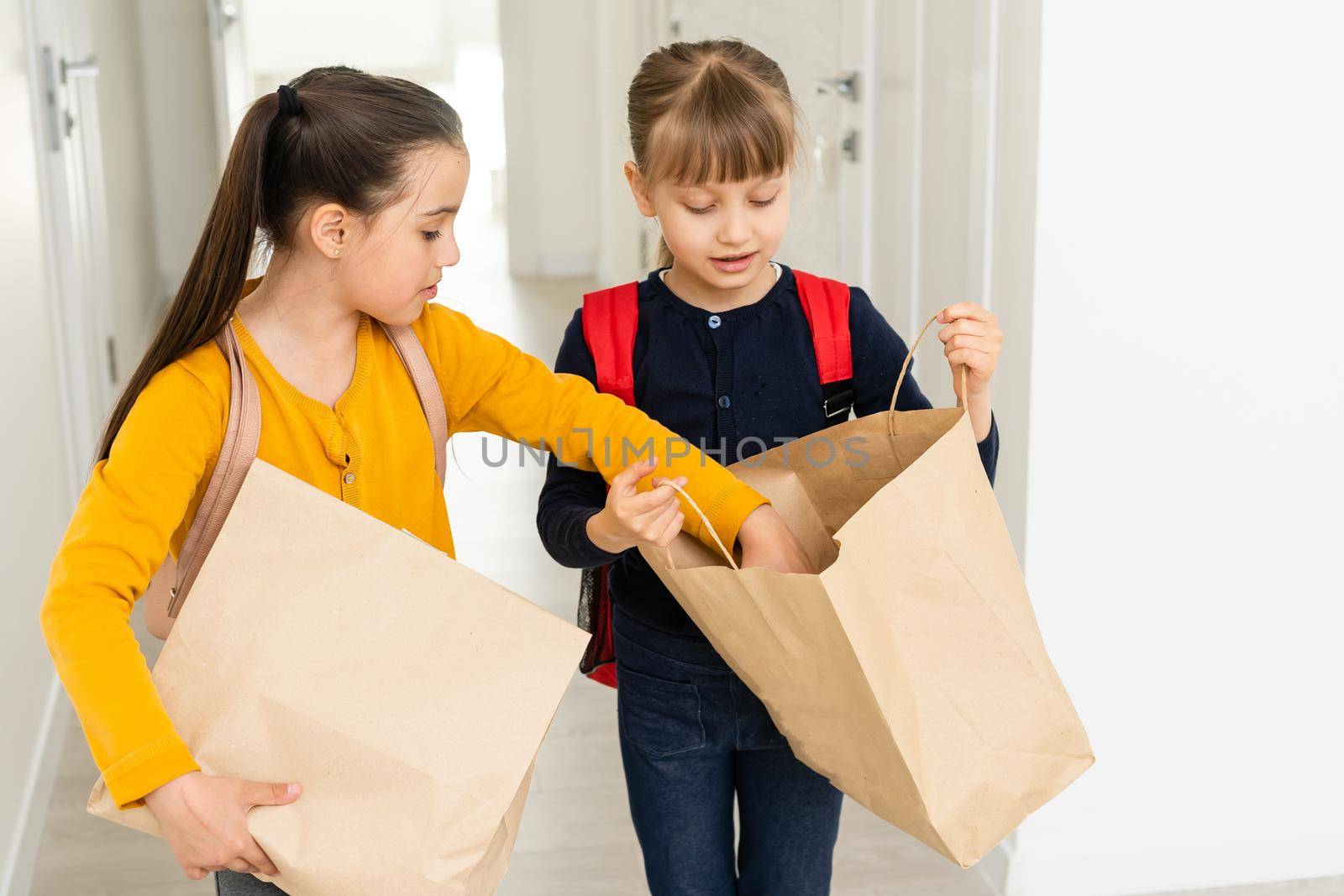 advertising, childhood, delivery, mail and people - two little girls with delivery packages.