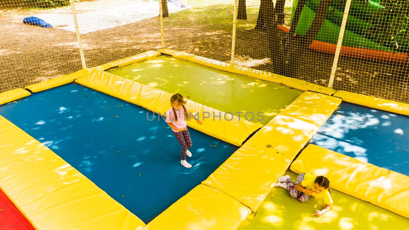 Children's fun on garden trampoline.