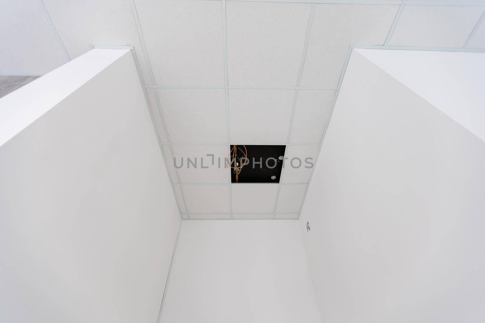 White ceiling in the office. White ceiling can reflect light well. The right light at work. Abstract empty white interior space office. copy space. by Andelov13