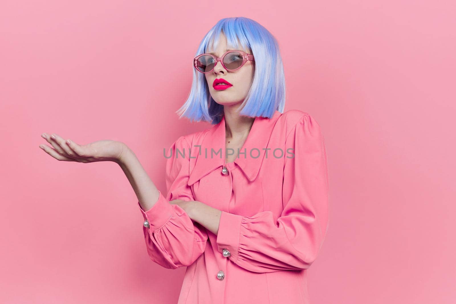 glamorous woman in sunglasses wears a blue wig makeup studio model. High quality photo