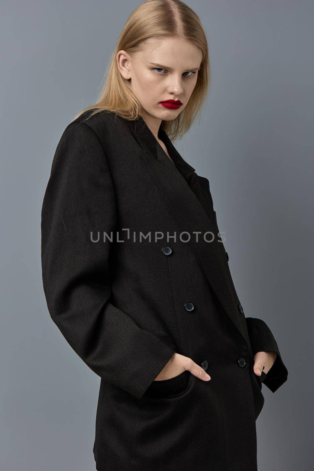 portrait of a woman fashion makeup in black jacket studio model unaltered. High quality photo