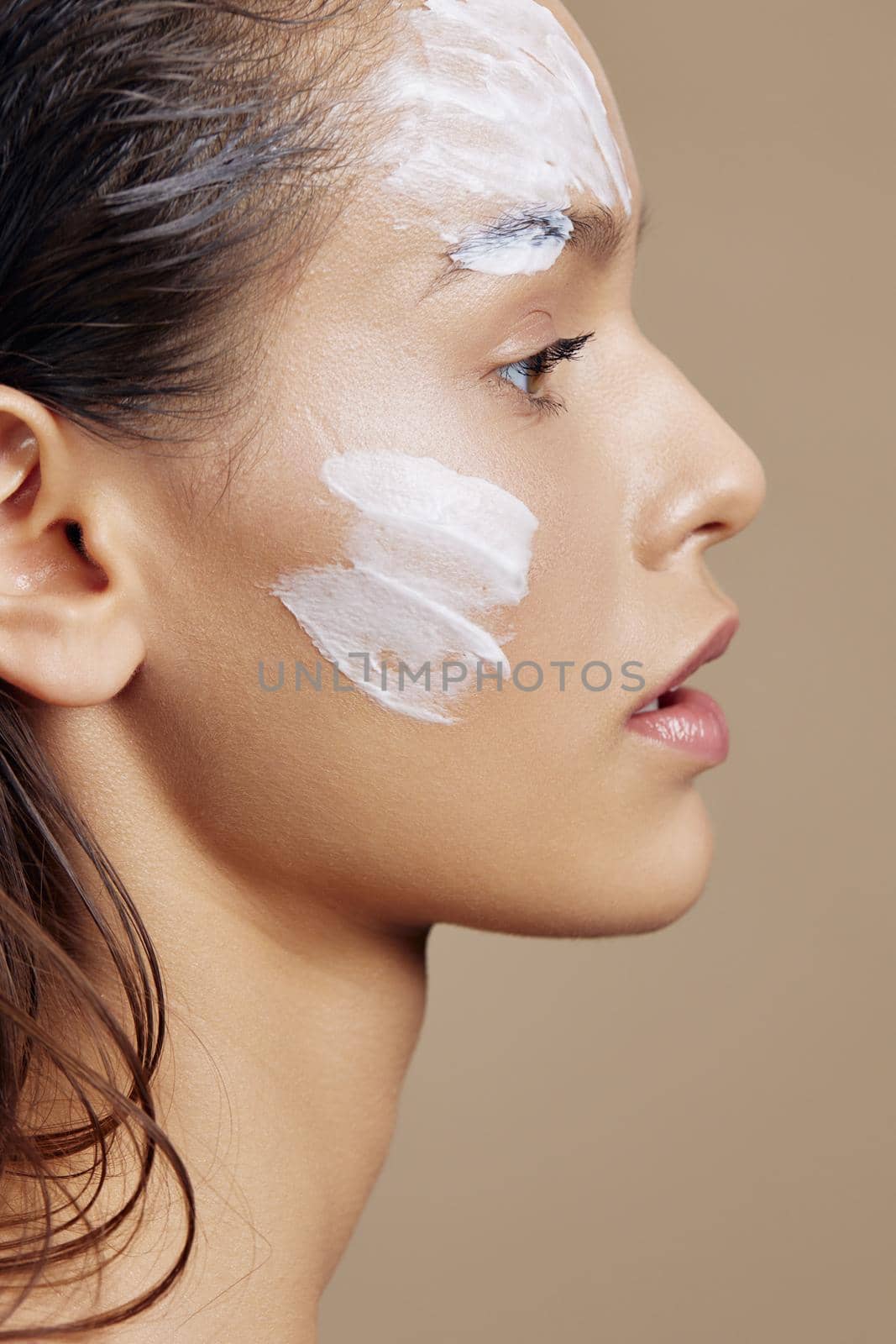 woman hand near face cream rejuvenation charm Youth and Skin Care Concept. High quality photo
