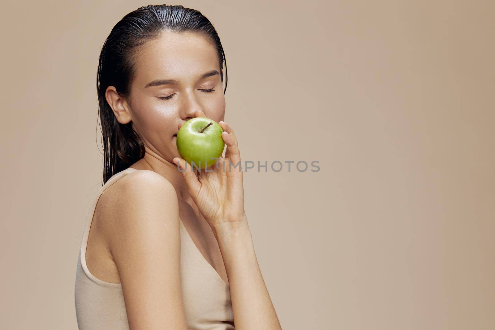 brunette happy smile green apple health close-up Lifestyle. High quality photo