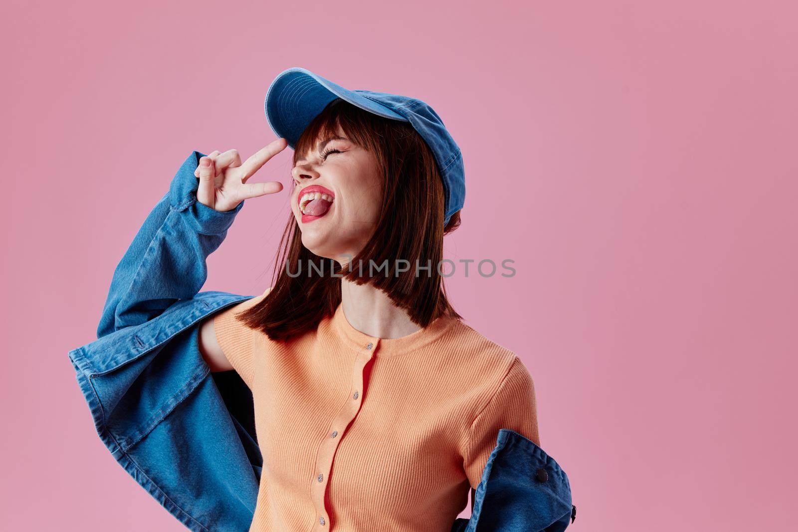 pretty woman denim cap red lips glamor fashion pink background unaltered by SHOTPRIME