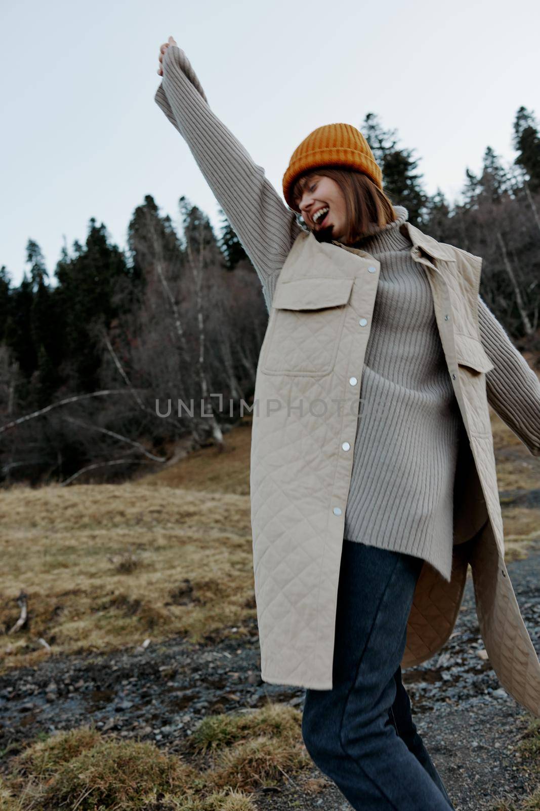 portrait of a woman walk outdoors autumn weather mountains relaxation. High quality photo