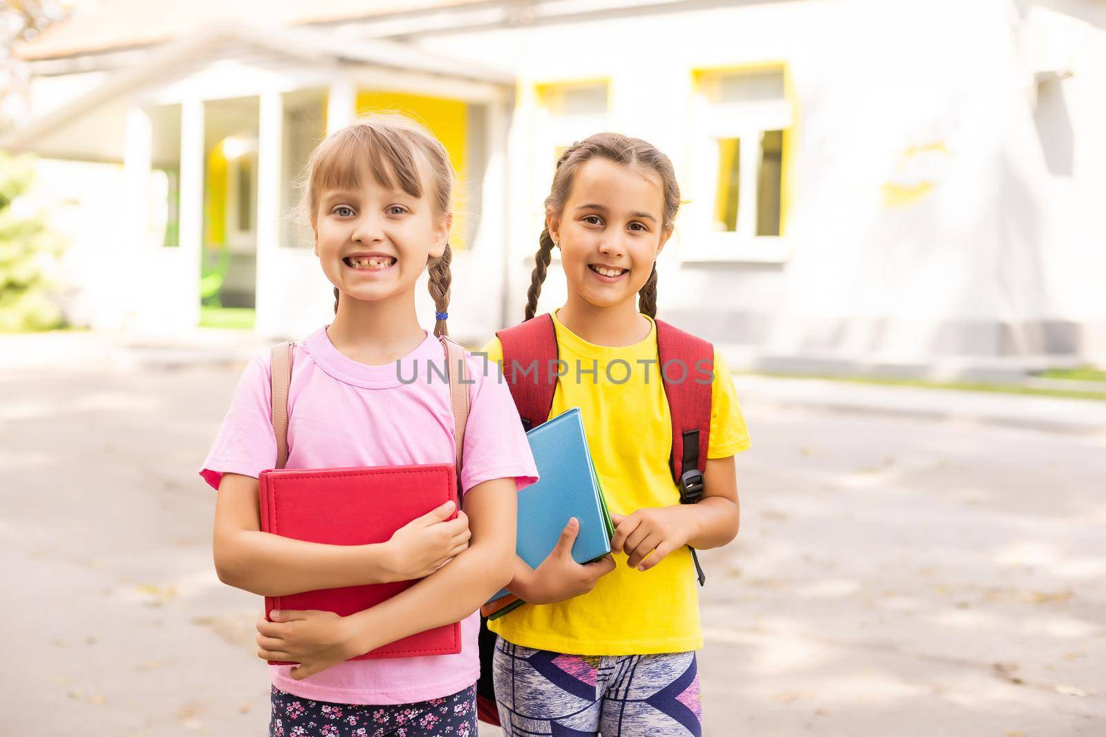 Basic school students crossing the road.