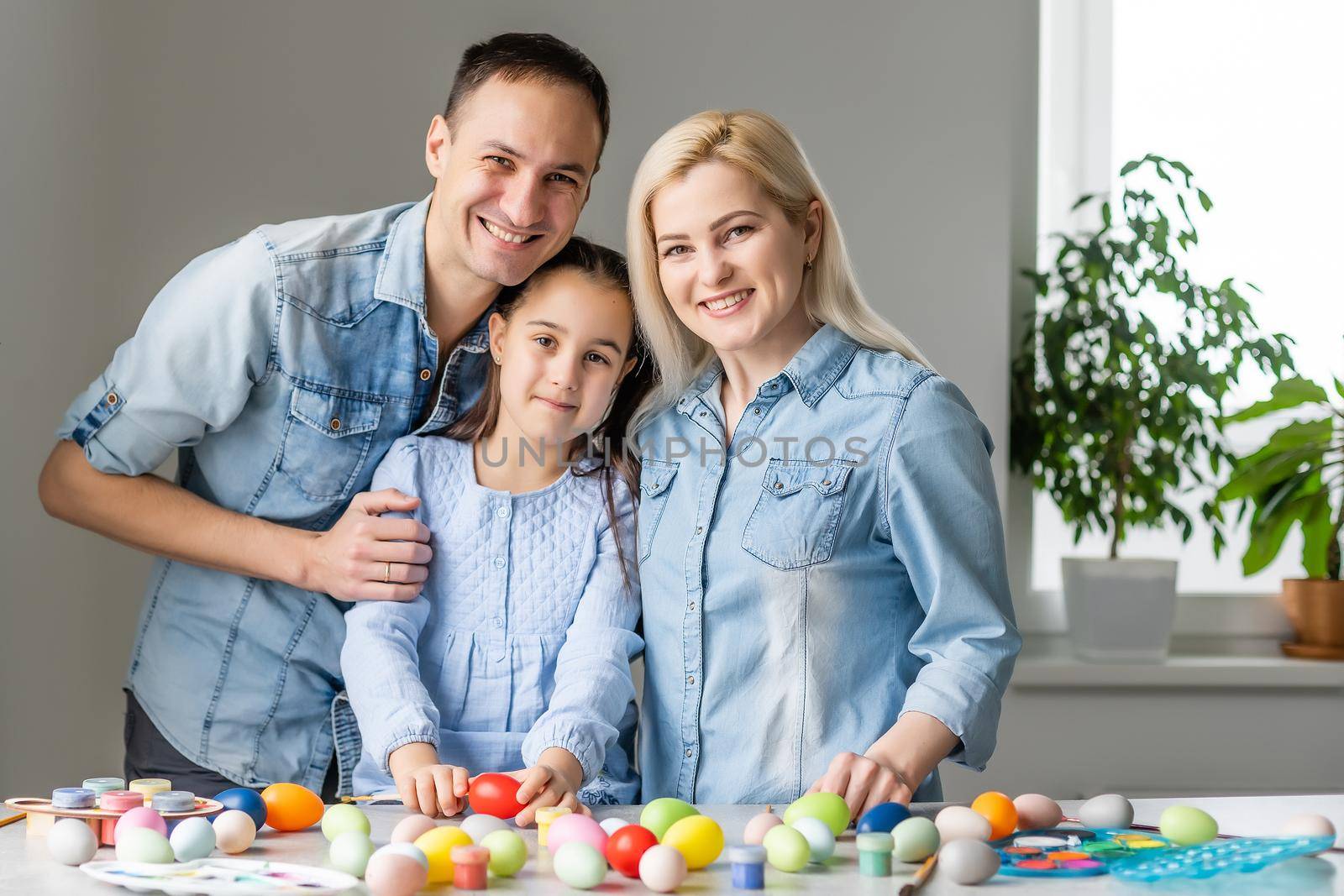 happy family with easter eggs. Happy family preparing for Easter.