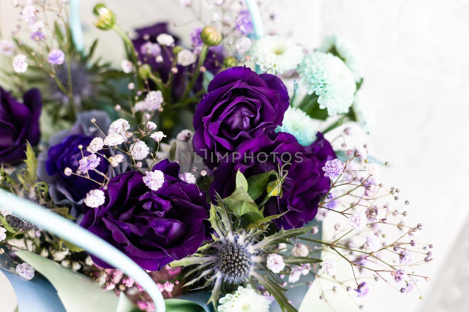 purple bouquet of roses and chrysanthemums. white background.