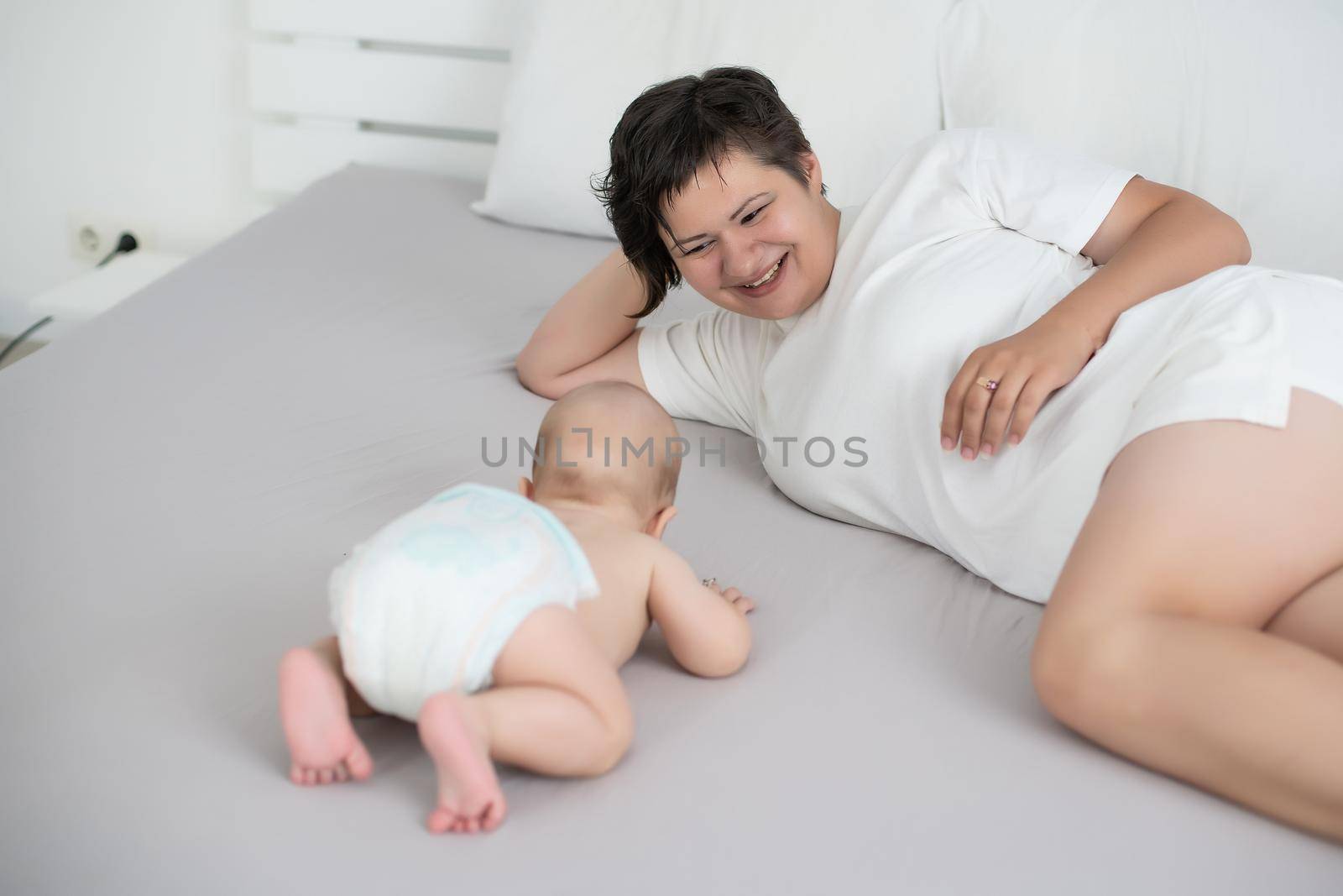 picture of happy mother with baby in hands.