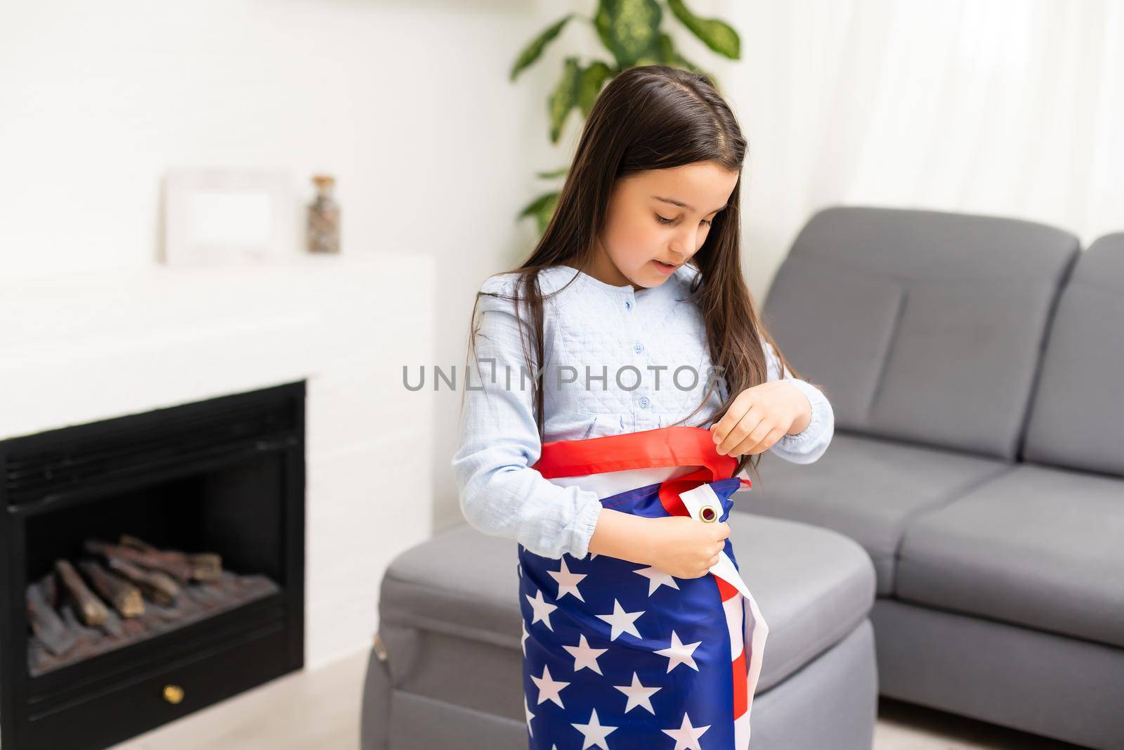 Portrait of a little girl with the flag of America. American education, study in America by Andelov13