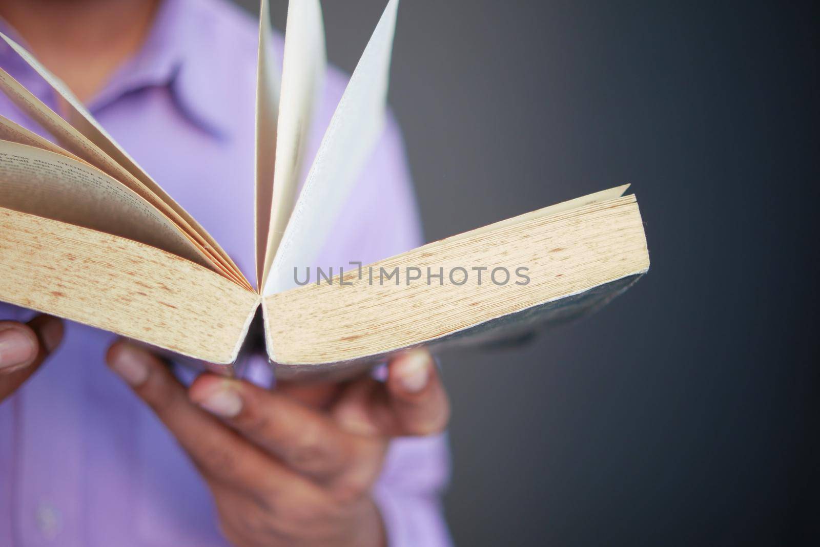 Close up of women hand turning a pager of a diary ,
