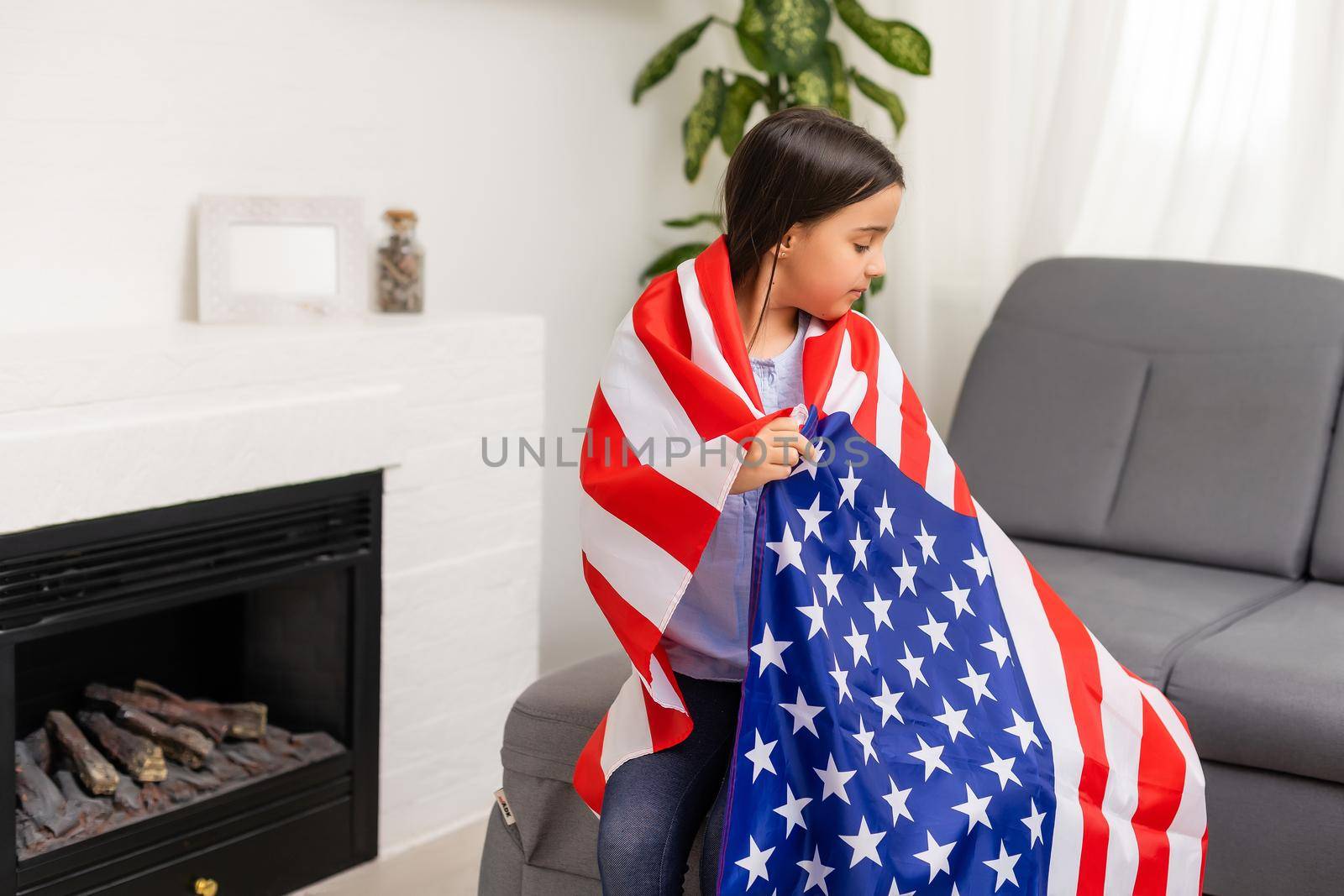 images of lovely little girl over USA flag background.