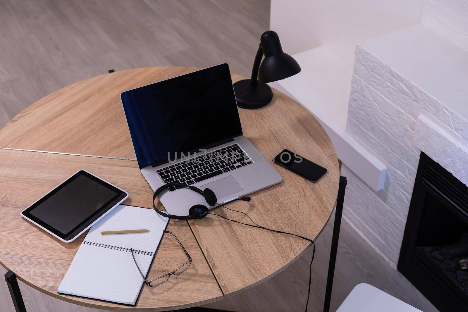 laptop with tablet and smart phone on table