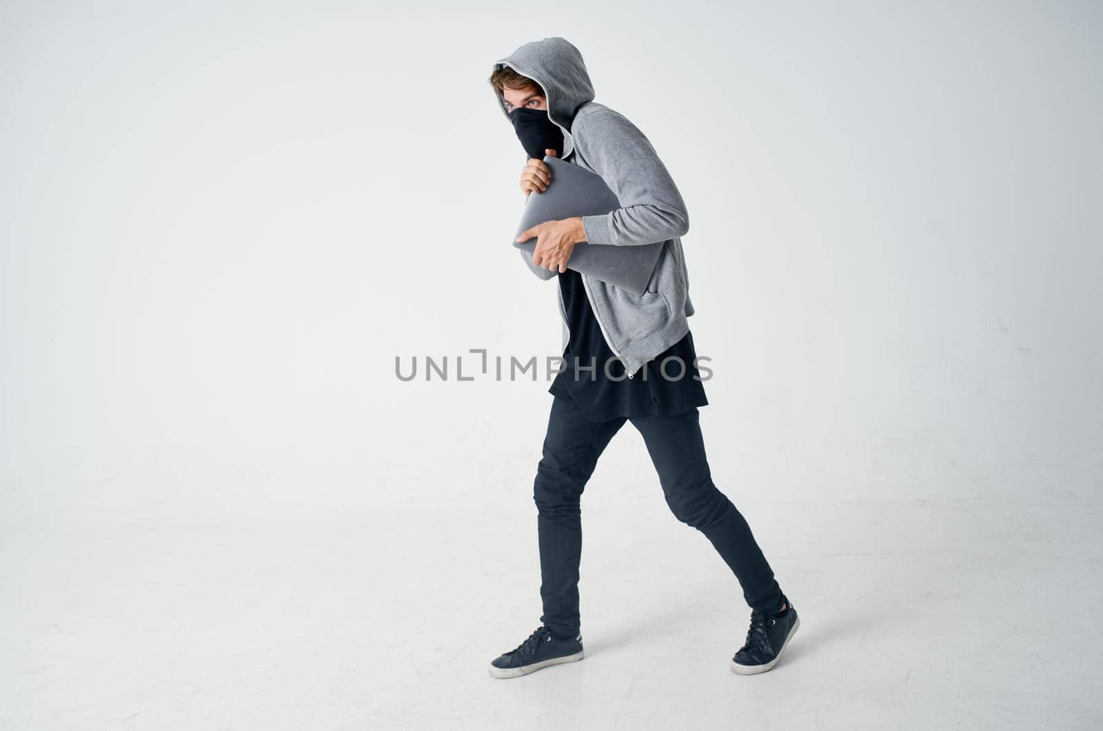 male thief stealth technique robbery safety hooligan isolated background. High quality photo