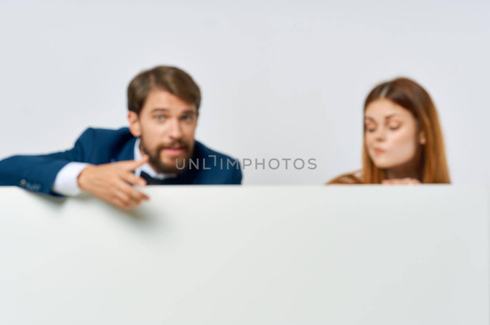 business man and woman billboard marketing fun emotions isolated background. High quality photo