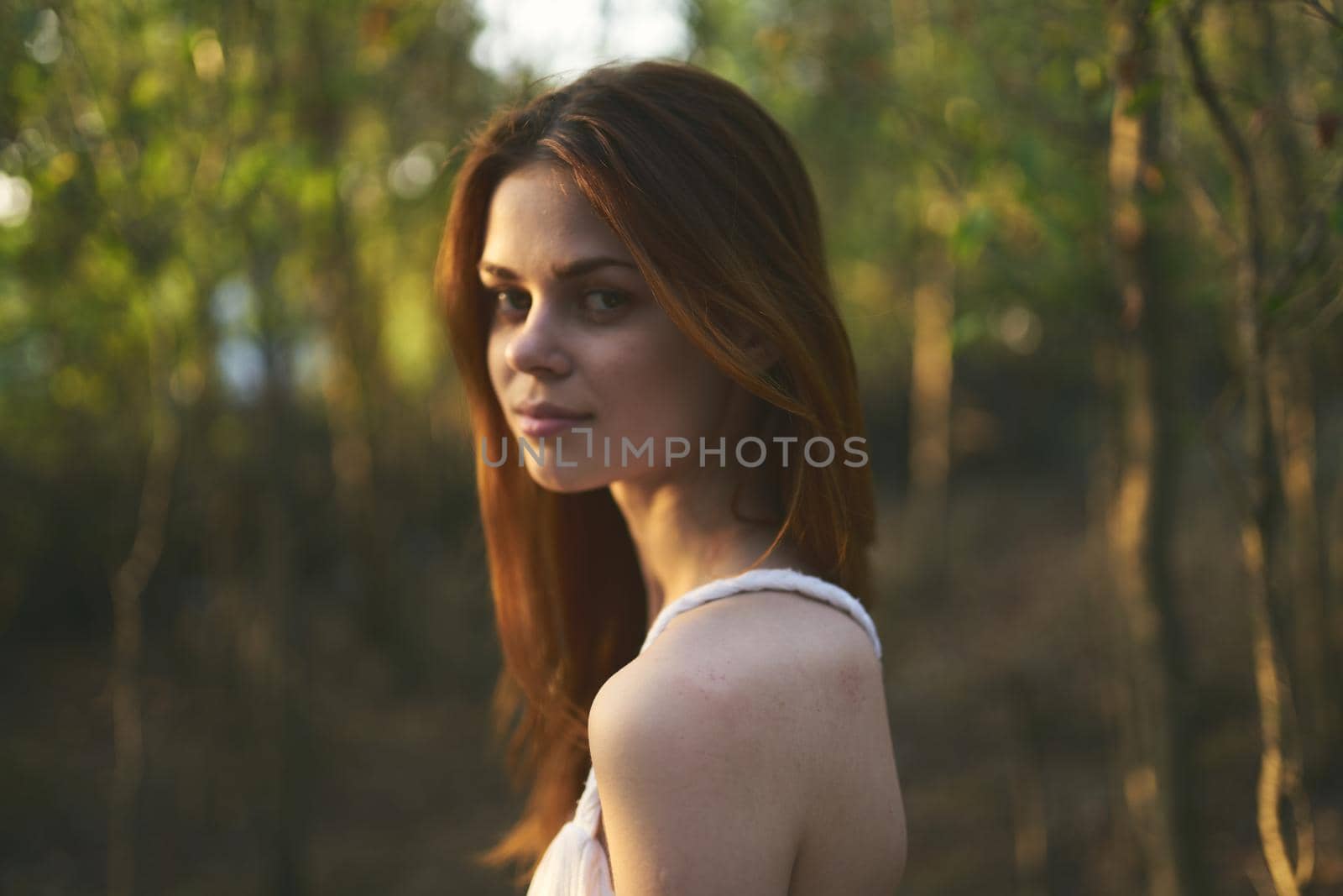 Woman in white dress nature walk forest summer trees by SHOTPRIME