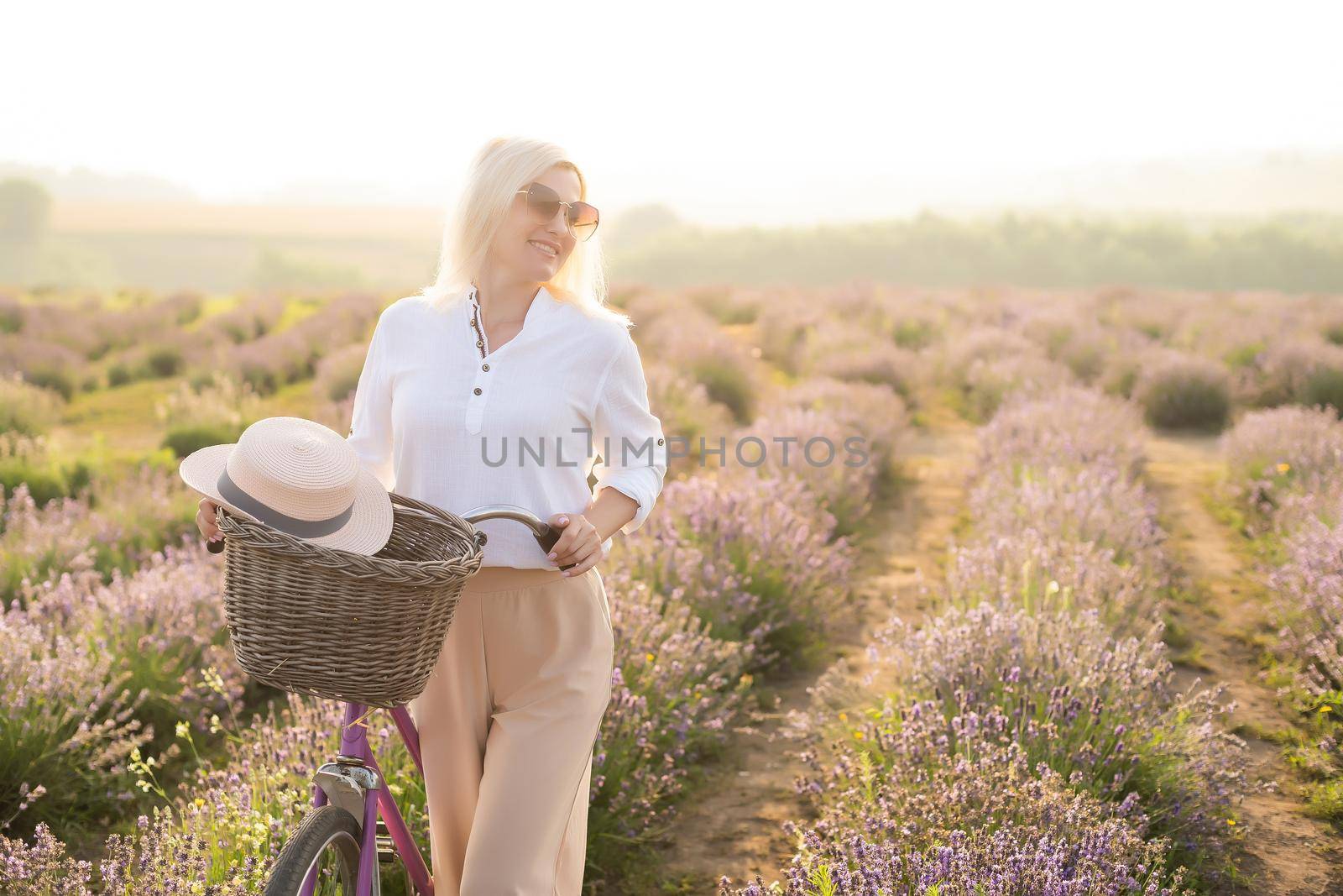 Beautiful woman on the lavender field.