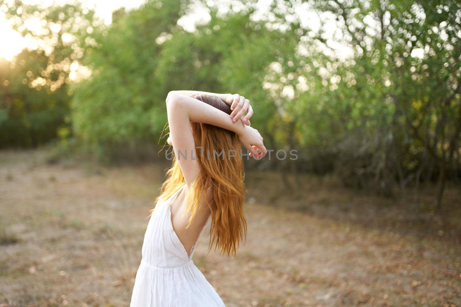 Woman in white dress nature trees vacation lifestyle. High quality photo