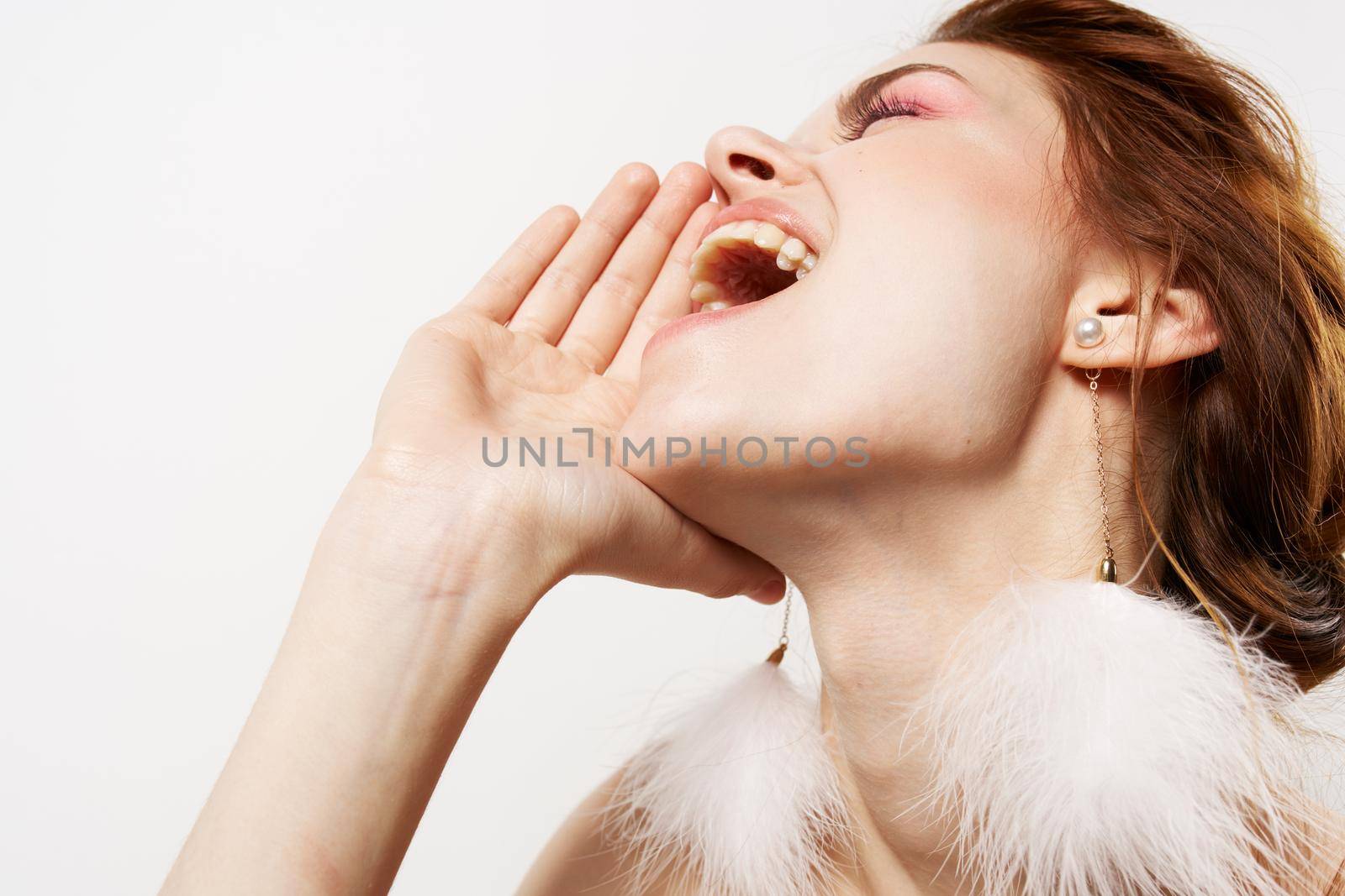 pretty woman eyes closed fluffy earrings bare shoulders glamor by SHOTPRIME