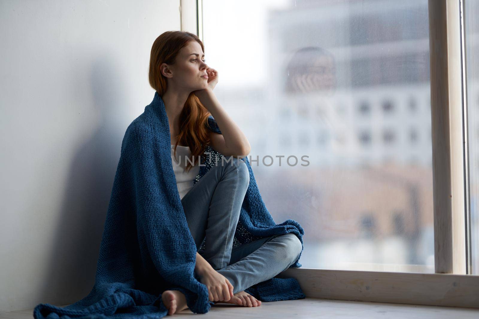 beautiful woman with a blue plaid rest morning dreamy look. High quality photo