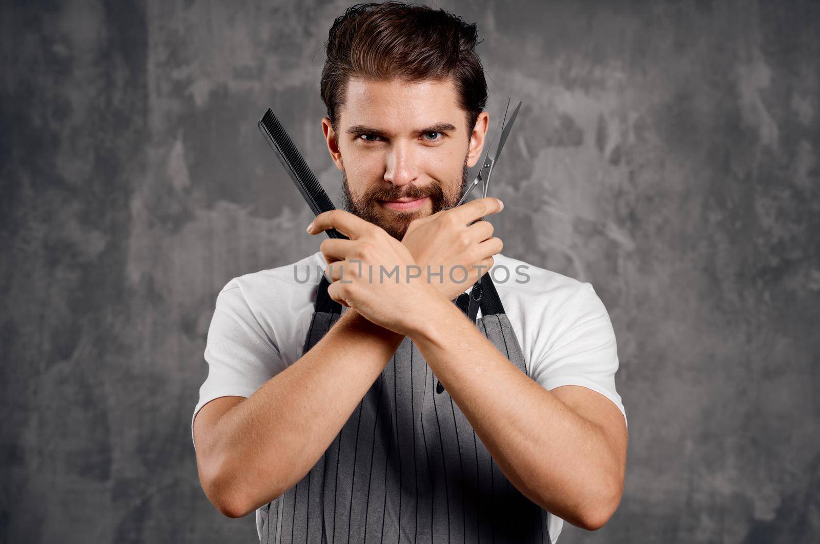 a man with a beard holds scissors and a comb in his hand hairdresser hair styling barbershop. High quality photo