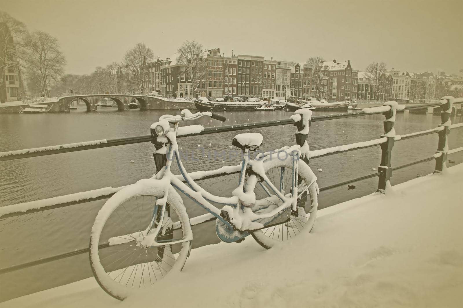 Old vintage photo from  Amsterdam at the Amstel in the Netherlands in winter by devy