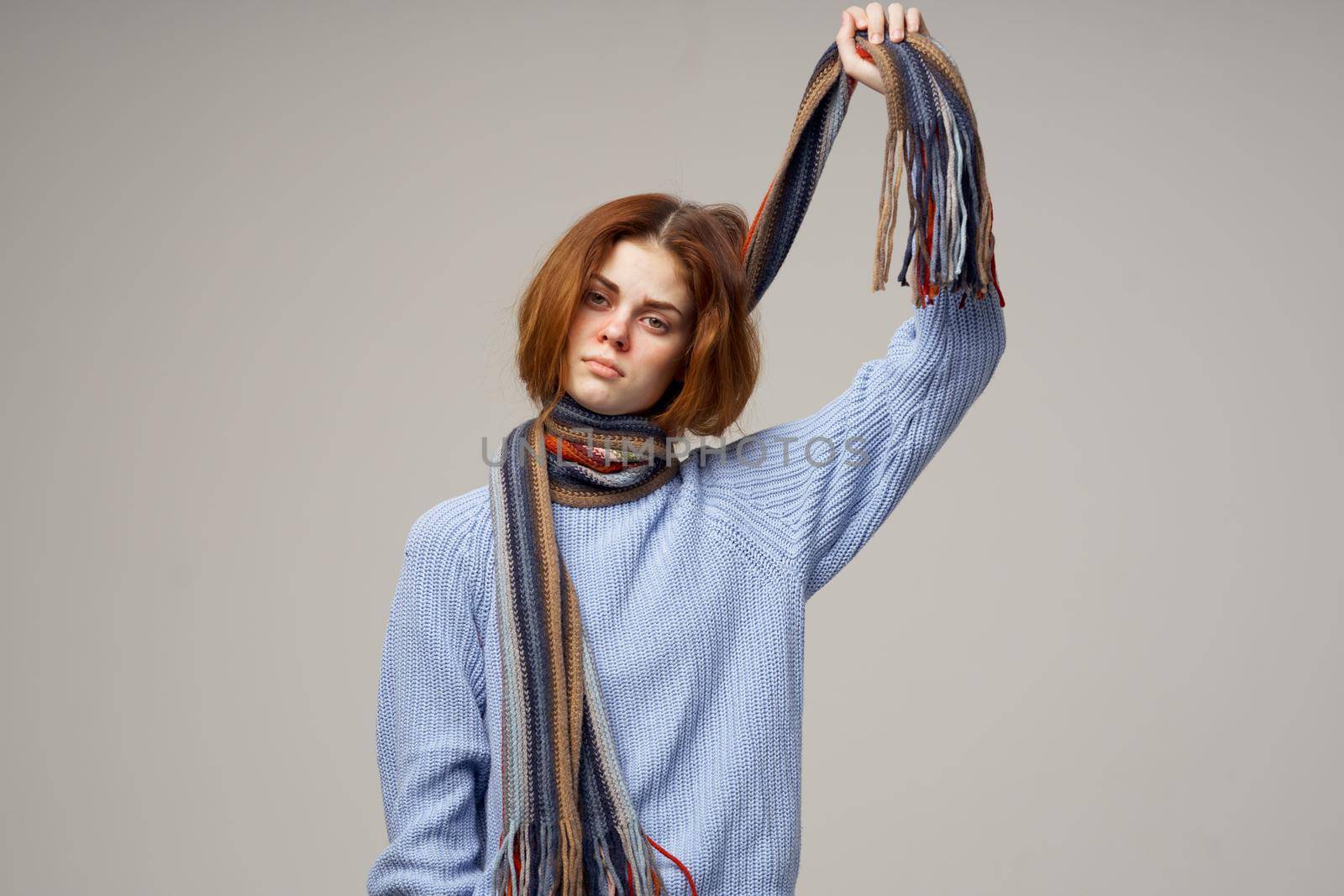 sick woman neck scarf cold handkerchief light background. High quality photo