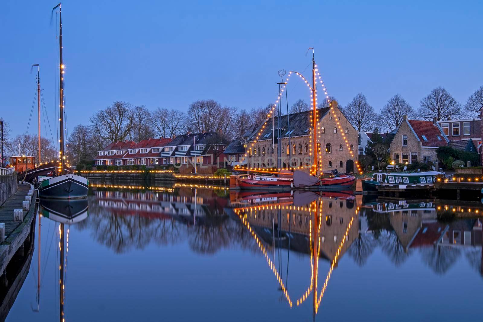 Historical city Dokkum in christmas time in the Netherlands at sunset